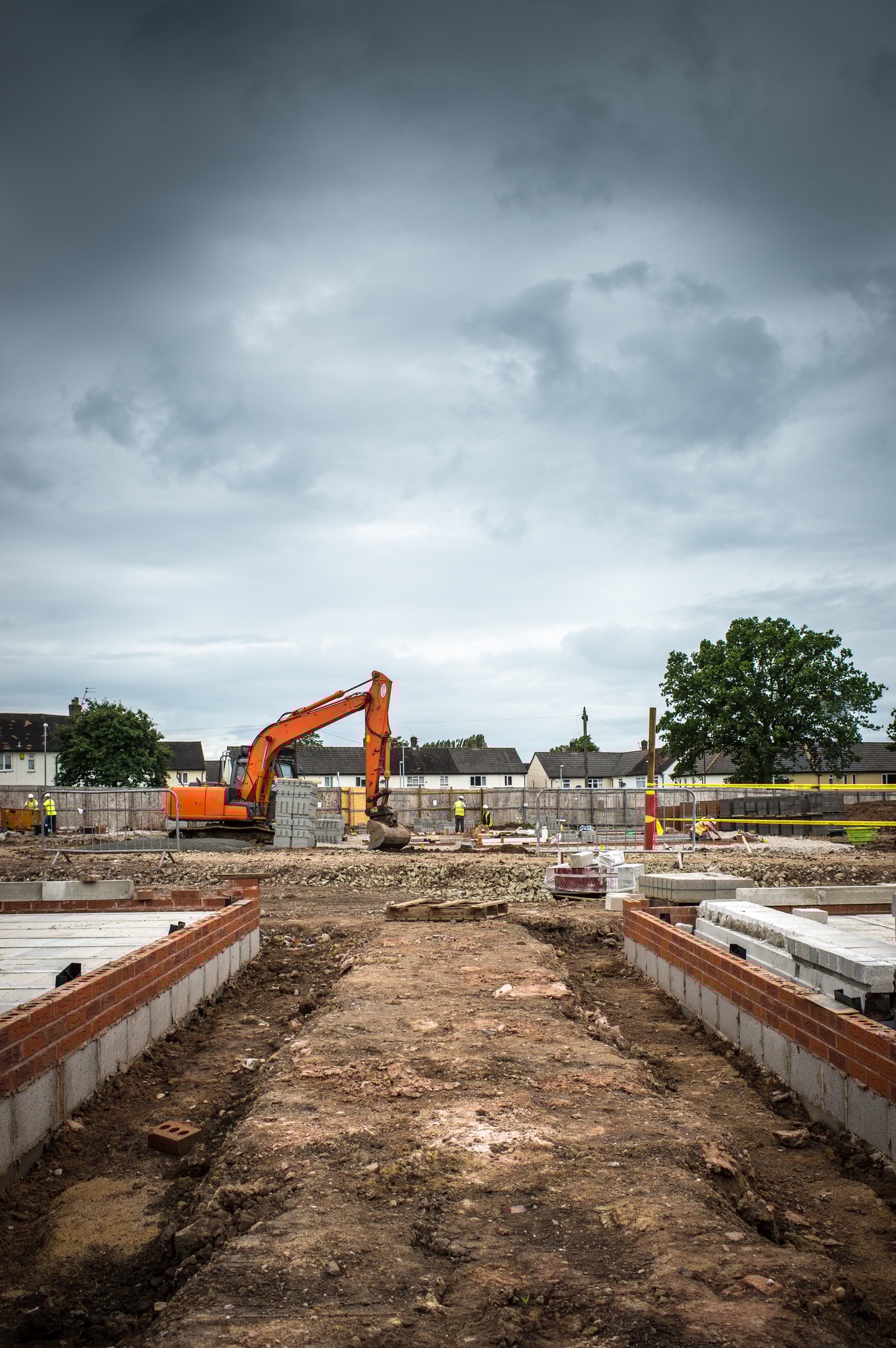 Tractor, building materials on construction site